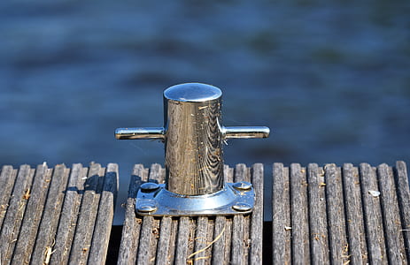 selective-focus photography of T-shaped pole on brown surface thumbnail