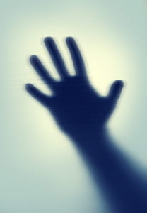 right hand on white glass panel thumbnail