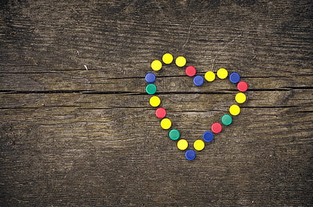 assorted-color of bottle caps formed heart thumbnail
