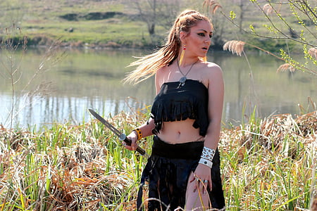 woman wearing black skirt holding gray steel sword thumbnail