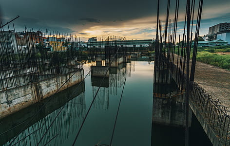 Photo of Metal Bars on Water Under Dark Sky thumbnail