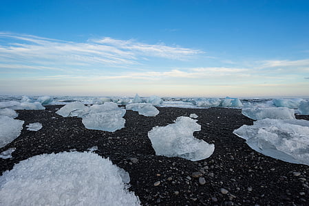 ice blocks on ground during daytime thumbnail