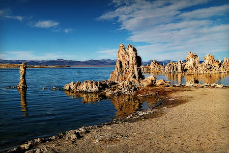 rock formations near blue ocean water during daytime thumbnail
