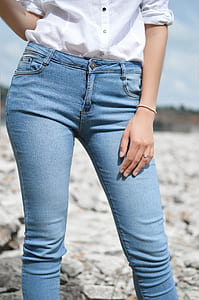 woman standing on gray rocks thumbnail