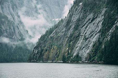 rock mountain formation beside sea thumbnail