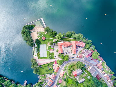 aerial photography of city near body of water thumbnail