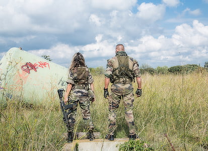 two soldiers wearing woodland camouflage uniforms standing on green grass field during daytime thumbnail