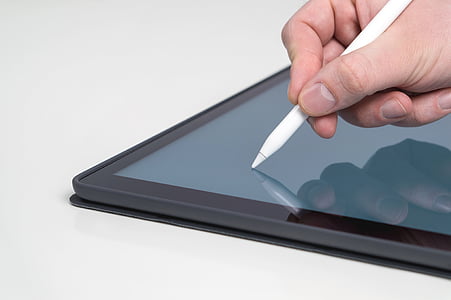 person holding white stylus thumbnail