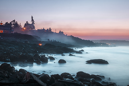 black rock beside sea shore thumbnail