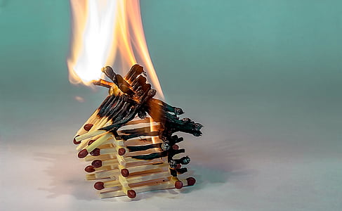 lit match sticks on white surface thumbnail