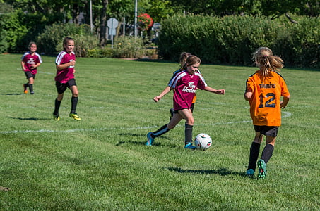 girl kicking the soccer ball thumbnail