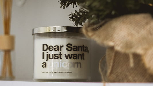 selective focus photography of dear Santa, i just want a unicorn scented candle jar thumbnail