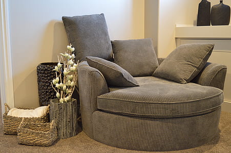grey fabric chair near white wall paint thumbnail