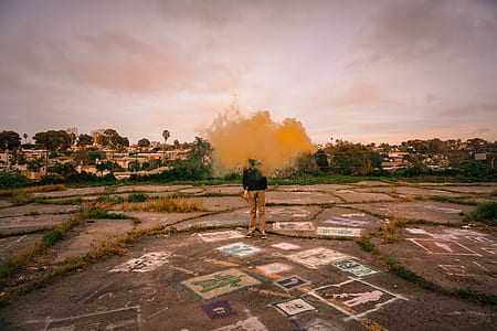 man standing on road while vaping thumbnail