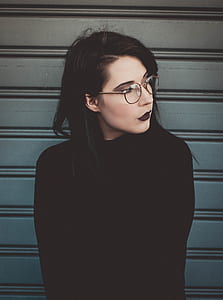woman wearing eyeglasses looking on side thumbnail