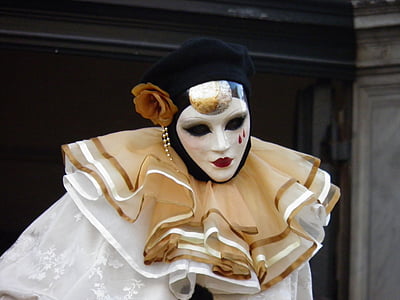 clown wearing white and brown dress thumbnail