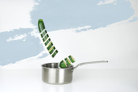 Gray Stainless Steel Sauce Pan and Green Cucumber Illustration thumbnail