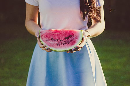 female holding water melon thumbnail