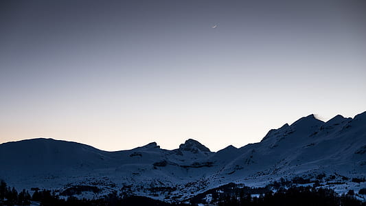 mountains covered by snow at daytime thumbnail