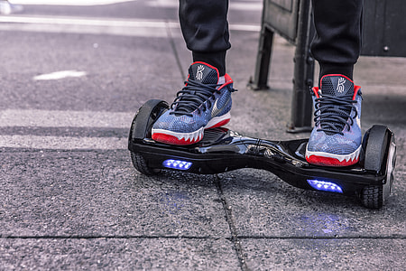 person using black self balancing board thumbnail