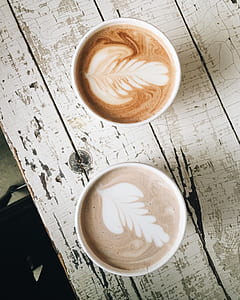 two coffee in white ceramic mugs thumbnail
