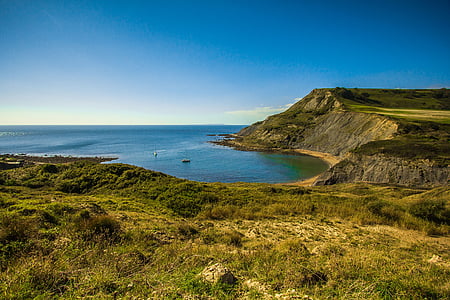 landscape photo of mountain near body of water thumbnail