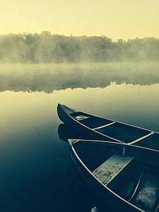two canoes on body of water thumbnail