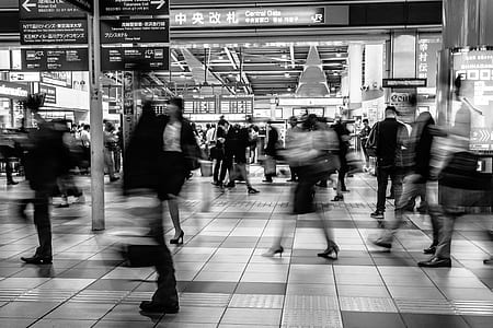 grayscale time lapse photography of group of person walking thumbnail