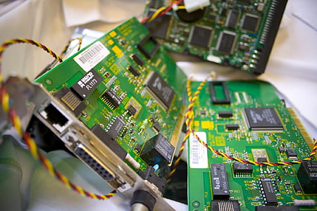 tilt-shift photography of three computer expansion cards thumbnail
