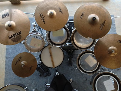 black drum set inside room thumbnail