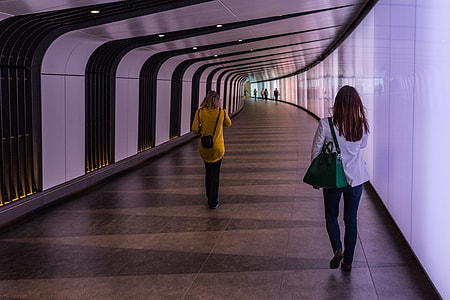 People walking down a futuristic light-wall tunnel at King’s Cross, London. This image was captured with a Canon 6D DSLR thumbnail