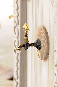close-up photo of gold-colored faucet thumbnail