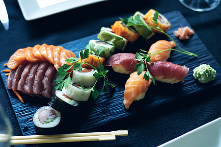 sushi on black board beside chopstick thumbnail