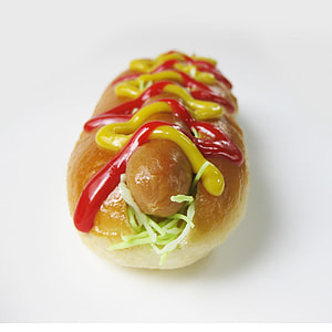 bun with footlong and coleslaw topped with mustard and ketchup thumbnail