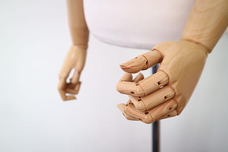 closeup photo of brown prosthetic arm thumbnail