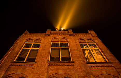 brown building at nighttime thumbnail