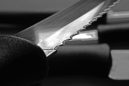 grayscale photography of knife thumbnail