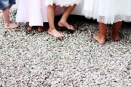 people on gray pebbles thumbnail