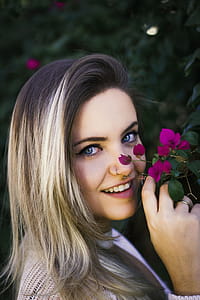 Woman Holding Purple Bougainvillea thumbnail