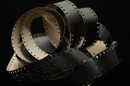 closeup photo of white and black camera film thumbnail