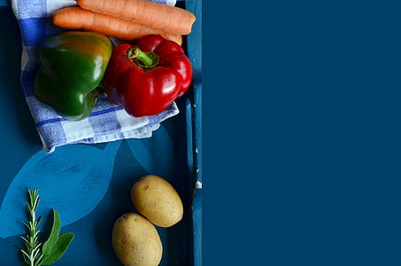 two red and green bell peppers, carrots, and potatoes thumbnail