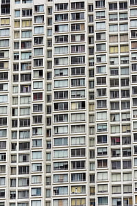 photo of white concrete building with glass windows thumbnail