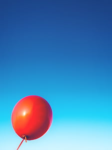 red balloon under clear blue sky thumbnail
