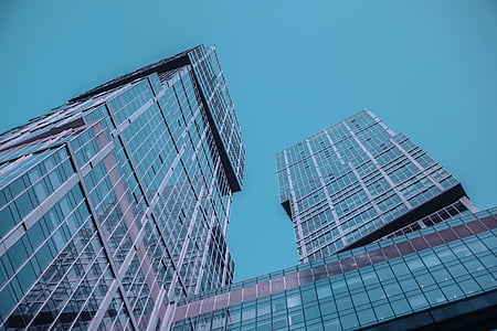 low-angle photography of gray glass building thumbnail