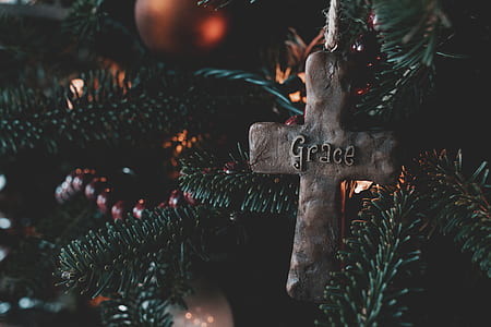 grey Grace cross ornament hanged on pine tree thumbnail