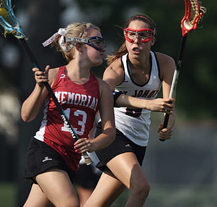 woman holding lacrosse stick thumbnail