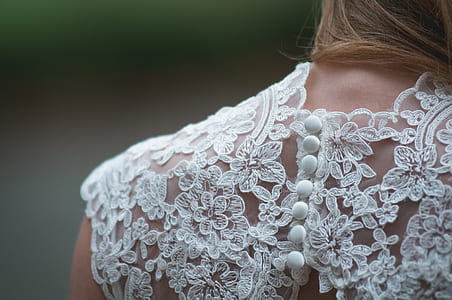 woman in white showing her brown hair thumbnail