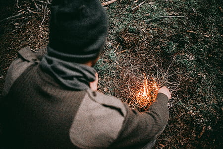 man igniting fire thumbnail