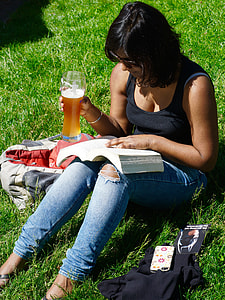 woman in black tank top holding glass of beer thumbnail