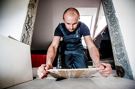person holding ceramic tile thumbnail